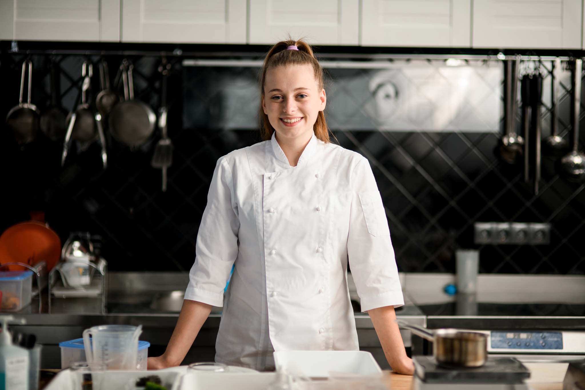 Young smiling woman chef